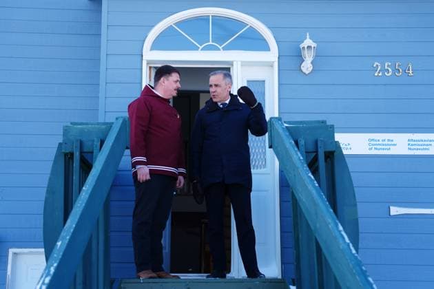 March 18, 2025, Iqaluit, Nunavut, Canada: Prime Minister Mark Carney, right, speaks with Nunavut Premier P.J. Akeeagok at the Nunavut Commissioner s official residence in Iqaluit, Nunavut, on Tuesday, March 18, 2025. Iqaluit Canada - ZUMAc35_ 20250318_zaf_c35_013 Copyright: xSeanxKilpatrickx