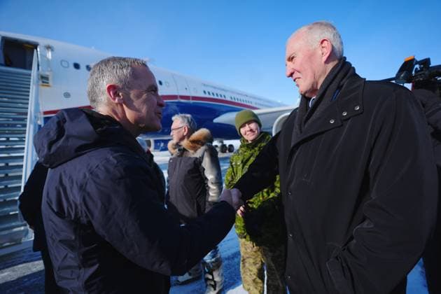 March 18, 2025, Iqaluit, Nunavut, Canada: Prime Minister Mark Carney shakes hands with Defence Minister Bill Blair as he arrives in Iqaluit, Nunavut, on Tuesday, March 18, 2025. Iqaluit Canada  - ZUMAc35_ 20250318_zaf_c35_023 Copyright: xSeanxKilpatrickx