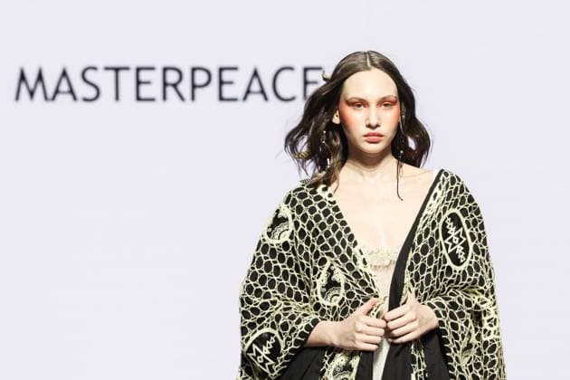 RUSSIA, MOSCOW - MARCH 18, 2025: A model showcases creations during a runway show for the collection by Masterpeace as part of the 4th Moscow Fashion Week at the Manege Central Exhibition Hall. Valery Sharifulin TASS  79203006