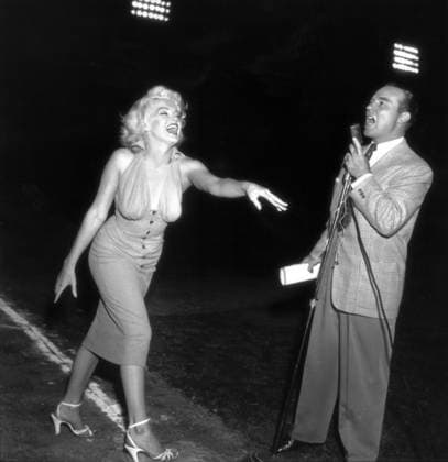 RECORD DATE NOT STATED Marilyn Monroe Circa 1952 in Hollywood, California: Hollywood icon actress MARILYN MONROE takes pitch to radio presenter RALPH EDWARDS at Seal Stadium for the Hollywood Entertainers Baseball Game 1952. Copyright: x1952,entertainment,film,Hollywood,MarilynxMonroe,movies,vintage,classic,RalphxEdwards,classicxHollywood,1950 s,vintagexHollywood,GoldenxAgexofxHollywood,x