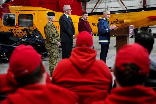 March 18, 2025, Iqaluit, Nunavut, Canada: Prime Minister Mark Carney, right to left, makes an announcement, as Nunavut Premier P.J. Akeeagok, Defence Minister Bill Blair and Chief of Defence Staff Gen. Jennie Carignan look on at a Canadian Armed Forces forward-operating location in Iqaluit, Nunavut, on Tuesday, March 18, 2025. Iqaluit Canada - ZUMAc35_ 20250318_zaf_c35_034 Copyright: xSeanxKilpatrickx