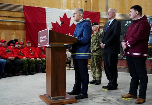 March 18, 2025, Iqaluit, Nunavut, Canada: Prime Minister Mark Carney, left to right, makes an announcement as Chief of Defence Staff Gen. Jennie Carignan, Defence Minister Bill Blair and Nunavut Premier P.J. Akeeagok look on at a Canadian Armed Forces forward-operating location in Iqaluit, Nunavut, on Tuesday, March 18, 2025. Iqaluit Canada - ZUMAc35_ 20250318_zaf_c35_043 Copyright: xSeanxKilpatrickx