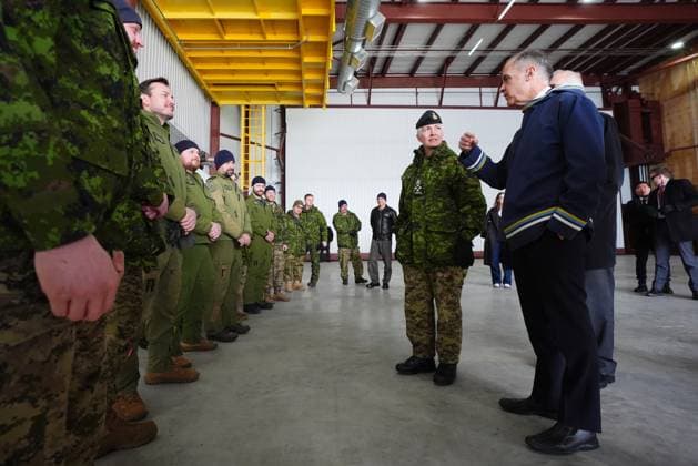 March 18, 2025, Iqaluit, Nunavut, Canada: Prime Minister Mark Carney, right, and Chief of Defence Staff Gen. Jennie Carignan speak to soldiers after making an announcement at a Canadian Armed Forces forward-operating location in Iqaluit, Nunavut, on Tuesday, March 18, 2025. Iqaluit Canada - ZUMAc35_ 20250318_zaf_c35_063 Copyright: xSeanxKilpatrickx