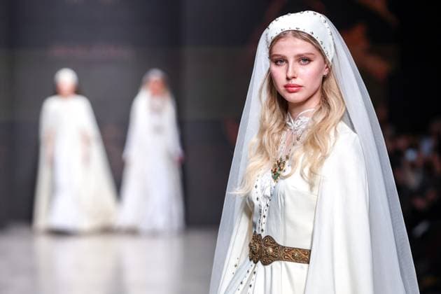 RUSSIA, MOSCOW - MARCH 18, 2025: A model showcases a creation by Bouzma ethnique during a runway show of the 4th Moscow Fashion Week at the Manege Central Exhibition Hall. Arina Antonova TASS  79211533