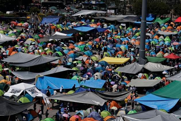 March 19, 2025, Mexico City, Cdmx, Mexico: Thousands of teachers from the National Coordinator of Education Workers (CNTE) are holding a 72-hour sit-in, setting up tents and banners in Constitution Square, in front of the National Palace in Mexico City, despite President Claudia Sheinbaum s decision to withdraw the initiative to reform the Law of the Institute of Security and Social Services for State Workers Mexico City Mexico - ZUMAp204 20250319_zip_p204_027 Copyright: xJosuexPerezx