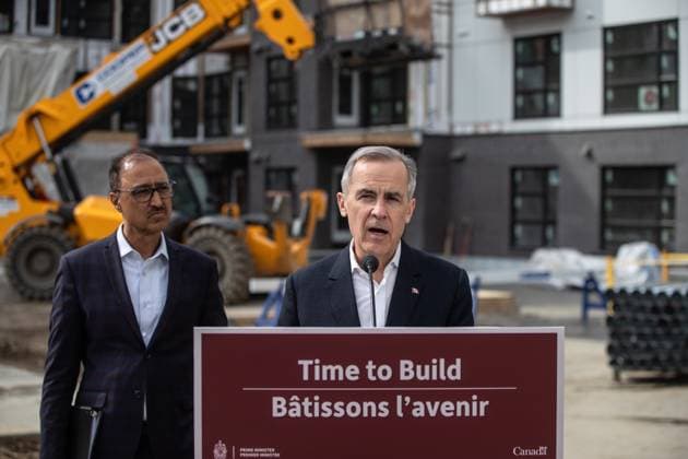 March 20, 2025, Edmonton, Ab, CANADA: Prime Minister Mark Carney announces funding for houses as Edmonton Mayor Amarjeet Sohi listens during a visit to Edmonton, Thursday, March 20, 2025. Edmonton CANADA  - ZUMAc35_ 20250320_zaf_c35_119 Copyright: xJasonxFransonx