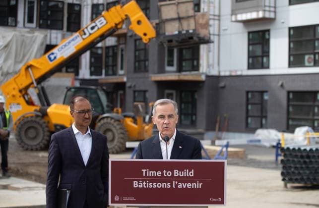 March 20, 2025, Edmonton, Ab, CANADA: Prime Minister Mark Carney announces funding for houses as Edmonton Mayor Amarjeet Sohi listens during a visit to Edmonton, Thursday, March 20, 2025. Edmonton CANADA  - ZUMAc35_ 20250320_zaf_c35_121 Copyright: xJasonxFransonx