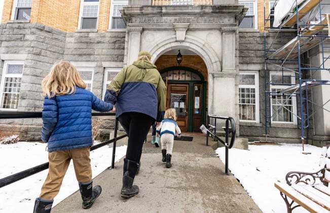 March 21, 2025, Derby Line, Vt, USA: A family from the United States enters the Haskell Free Library and Opera House in Derby Line, Vt., on Friday, March 21, 2025. The town of Stanstead, Que., says U.S. authorities have unilaterally decided to close the main Canadian access to the Victorian-style library that straddles the border between the two countries. Derby Line USA - ZUMAc35_ 20250321_zaf_c35_013 Copyright: xChristinnexMuschix