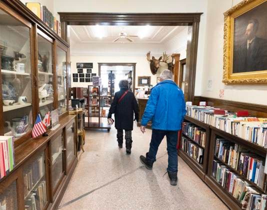 March 21, 2025, Derby Line, Vt, USA: A couple from Canada pass the international border line into Canada inside the Haskell Free Library and Opera House from Derby Line, Vt., on Friday, March 21, 2025. The town of Stanstead, Que., says U.S. authorities have unilaterally decided to close the main Canadian access to the Victorian-style library that straddles the border between the two countries. Derby Line USA - ZUMAc35_ 20250321_zaf_c35_014 Copyright: xChristinnexMuschix