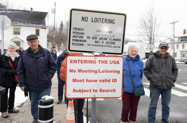 March 21, 2025, Stanstead, Qc, CAN: Americans offer silent support as they stand on their side of the border to watch a press conference about the Haskell Free Library and Opera House in Stanstead, Que., on Friday, March 21, 2025. The town of Stanstead says U.S. authorities have unilaterally decided to close the main Canadian access to the Victorian-style library that straddles the border between the two countries. Stanstead CAN  - ZUMAc35_ 20250321_zaf_c35_040 Copyright: xChristinnexMuschix
