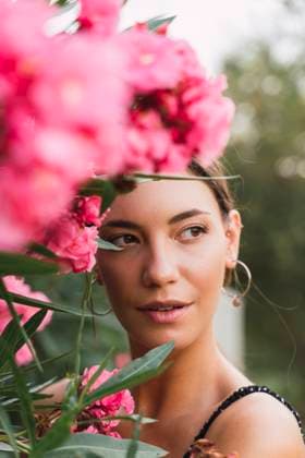 Creative Highlights Symbolfotos Portrait of young woman in a park with pink blossoming flowers model released, Symbolfoto, AFVF04205