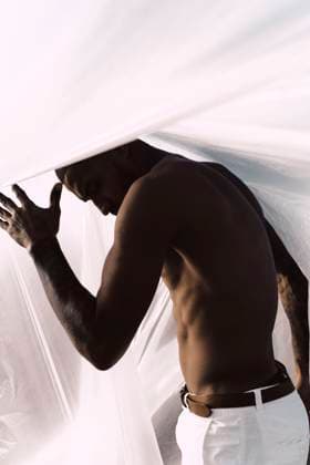 Creative Highlights Symbolfotos Barechested young man inside a plastic foil model released, Symbolfoto, ERRF02473