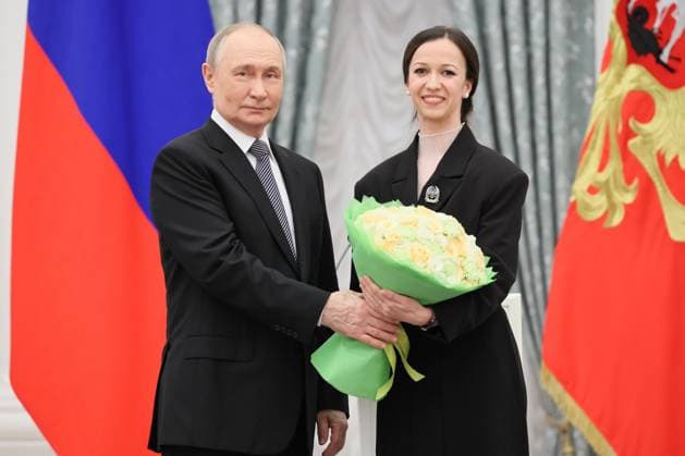 RUSSIA, MOSCOW - MARCH 25, 2025: Russia s President Vladimir Putin (L) and Russian Presidential Prize winner, Mariinsky Theatre ballet dancer Renata Shakirova are seen during a ceremony in the Kremlin to present Russian Presidential Prizes in Culture, Literature and Art for Year 2024 to young professionals for their works aimed at children and youth. Sergei Savostyanov TASS  79356443