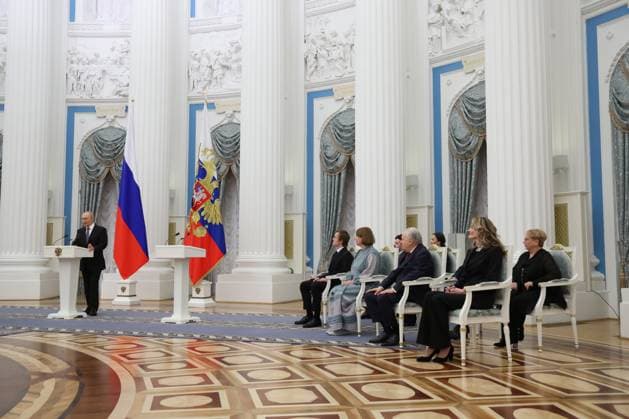 RUSSIA, MOSCOW - MARCH 25, 2025: Russia s President Vladimir Putin (L) speaks during a ceremony in the Kremlin to present Russian Presidential Prizes in Culture, Literature and Art for Year 2024 to young professionals for their works aimed at children and youth. Vyacheslav Prokofyev Russian Presidential Press and Information Office TASS  79356971