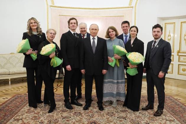 RUSSIA, MOSCOW - MARCH 25, 2025: Russia s President Vladimir Putin (C) and Russian Presidential Prize winners pose for a group photograph after a ceremony in the Kremlin in which President Putin presented Russian Presidential Prizes in Culture, Literature and Art for Year 2024 to young professionals for their works aimed at children and youth. From left to right: Loktev Song and Dance Ensemble head choir master Anna Averyanenko, Loktev Song and Dance Ensemble head choreographer Marina Yegorova, Artistic Director of the Moscow State Academic Symphony Orchestra Ivan Nikiforchin and Loktev Song and Dance Ensemble artistic director Leonid Fradkin. From right to left: Moscow Architectural Institute head Alexei Kapustin, Mariinsky Theatre ballet  79357476