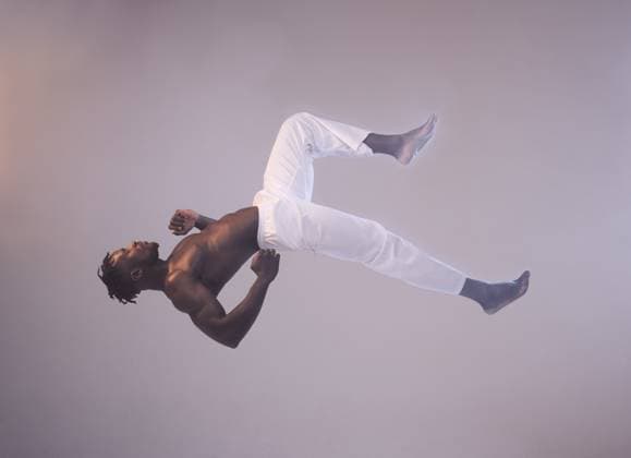 Creative Highlights Symbolfotos Dance, flip and air with profile of black man in studio for performance, theater and contemporary. Training, creative and artist with person on white background for talent, movement and showcase. model released property released Copyright: xwww.peopleimages.comx