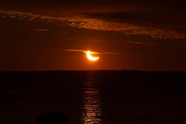 March 29, 2025, Halifax, Ns, Canada: A partial solar eclipse rises over the Atlantic Ocean in Halifax on Saturday, March 29, 2025. Halifax Canada  - ZUMAc35_ 20250329_zaf_c35_005 Copyright: xDarrenxCalabresex