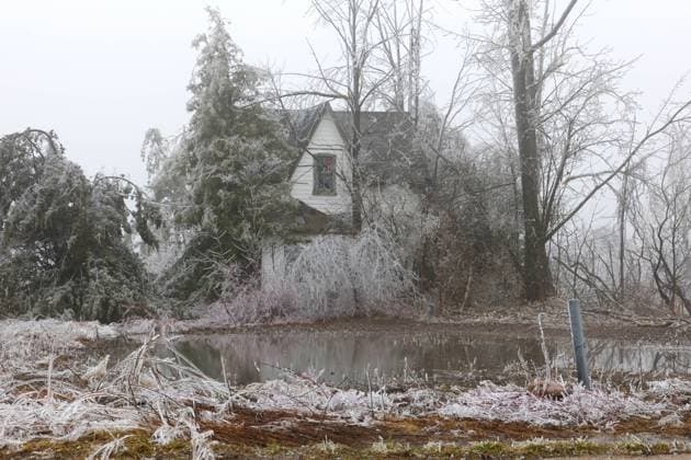 March 30, 2025, Innisfil, Ont, CANADA: A farmhouse in Innisfil, Ontario after a multi-day complicated weather system hit the area with ice, freezing rain and snow - causing many tree branches and hydro wires to fall - leaving more than 250,000 hydro customers without power throughout the region. Hydro has advised customers in rural areas it may take longer than 48 hours to restore service. Innisfil CANADA - ZUMAs109 20250330_zaf_s109_018 Copyright: xChristopherxDrostx