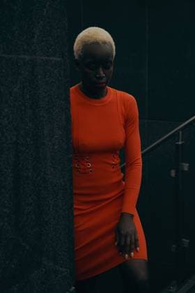 Creative Highlights Symbolfotos Young blonde black woman outdoors. She is wearing orange dress Wroc?aw, Lower Silesian Voivodeship, Poland CR_PJWUOI250326-1691427-01 ,model released, Symbolfoto