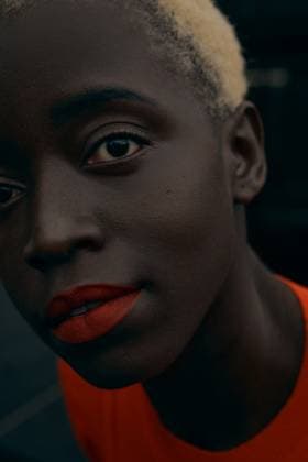 Creative Highlights Symbolfotos Young blonde black woman outdoors. She is wearing orange dress Wroc?aw, Lower Silesian Voivodeship, Poland CR_PJWUOI250326-1691431-01 ,model released, Symbolfoto
