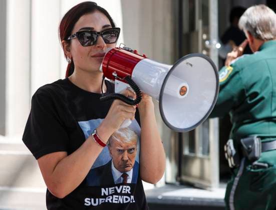 October 5, 2023, Tampa, Florida, USA: LAURA LOOMER, 30, from The Villages, the leader of the Never DeSantis Â movement, uses her megaphone as she supports former President Trump outside before a Gov. DeSantis campaign event at The Vault. Tampa USA - ZUMAs70_ 20231005_zan_s70_006 Copyright: xDirkxShaddx