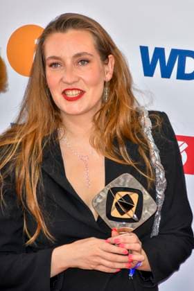 Clara Stella Hueneke director accompanied by Sisterqueens award winner as guest at the 61 Grimme Award ceremony on 04 04 2025 in Marl NRW Germany