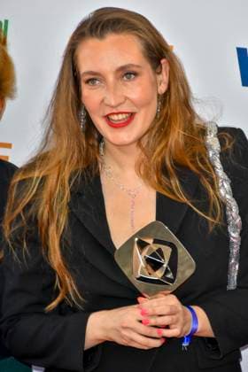 Clara Stella Hueneke director accompanied by Sisterqueens award winner as guest at the 61 Grimme Award ceremony on 04 04 2025 in Marl NRW Germany