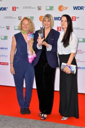 Steffi Niederzoll accompanied by Seven Winters in Tehran Award winner as a guest at the 61 Grimme Award ceremony on 04 04 2025 in Marl NRW Germany