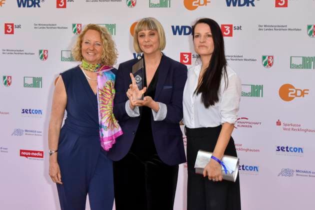 Steffi Niederzoll accompanied by Seven Winters in Tehran Award winner as a guest at the 61 Grimme Award ceremony on 04 04 2025 in Marl NRW Germany