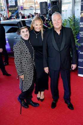 Albert de Paris as Charlie Chaplin, Franziska van Almsick and Jürgen B Harder at the presentation of the 25 Radio Regenbogen Award 2025 in the Europa Park Arena Rust, 04 04 2025 Foto:xS.xGabschx xFuturexImagex regenbogen_5403