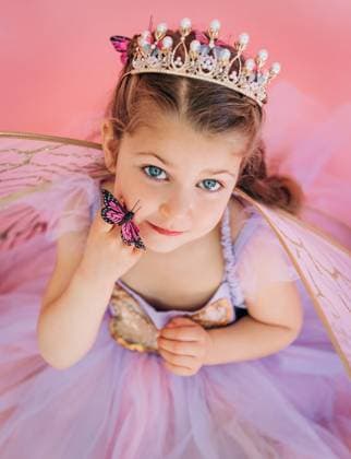 Creative Highlights Symbolfotos Girl in crown and fairy wings holds butterfly near her cheek North Andover, Massachusetts, United States R_FKNH250402-1694945-01 ,model released, Symbolfoto