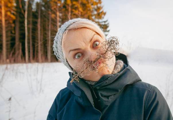 Creative Highlights Symbolfotos A woman grimaces with a dry branch instead of a mustache Moscow, Moscow, Russia R_VDXM250402-1698694-01 ,model released, Symbolfoto