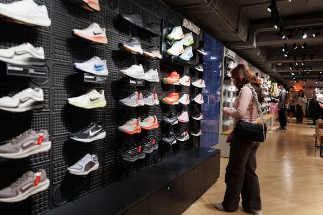 April 6, 2025, Hong Kong, China: A customer looking at Nike shoes inside Nikeâ€⠢s store in Hong Kong on Sunday, April 6, 2025. Photo .Nike, one of the worldâ€⠢s biggest sportswear brands, is facing fresh challenges as the U.S. government announces steep new tariffs on imports from Vietnamâ€up to 49% on some goods. Nearly 50% of its footwear and 28% of its clothing are made in Vietnam..While Vietnamâ€⠢s government has offered to negotiate with the U.S., even proposing to drop tariffs on American goods, Nike has giving no public response. The situation raises big questions about rising costs, possible delays, and how brands will handle supply chain risks going forward. Hong Kong China - ZUMAj323 20250406_zip_j323_031 Copyright: xMayxJamesx
