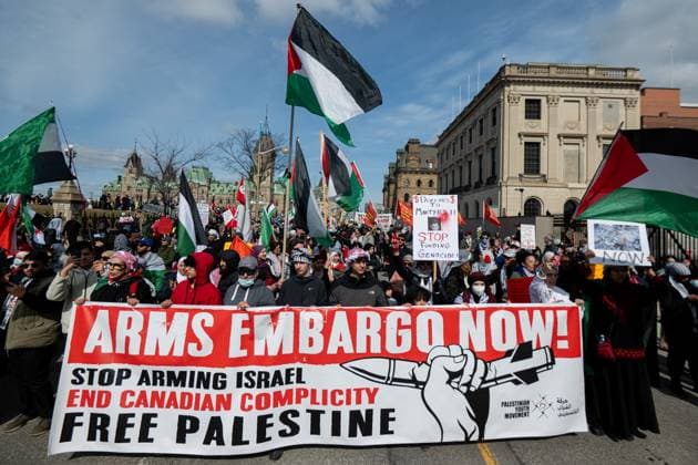 April 12, 2025, Ottawa, On, Canada: Pro-Palestinian protestors are seen during a demonstration protesters are calling a National March for Palestine near Parliament Hill in Ottawa, on Saturday, April 12, 2025. Ottawa Canada  - ZUMAc35_ 20250412_zaf_c35_061 Copyright: xSpencerxColbyx