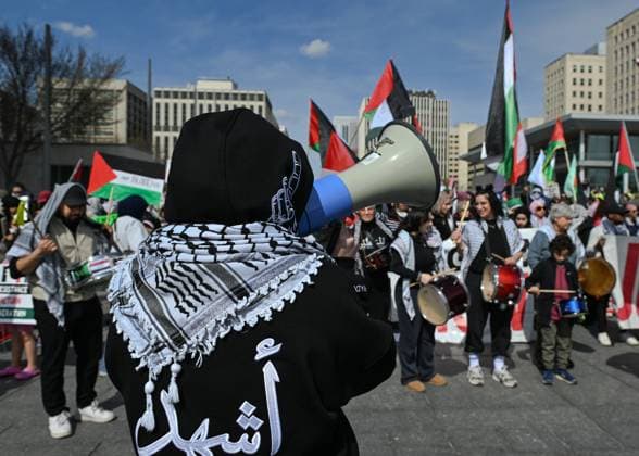 Demonstrators And Police Clash During Palestinian Solidarity Rally In Edmonton EDMONTON, CANADA APRIL 13 Activists, supporters of the Palestinian cause, and members of the local Palestinian diaspora gather during the Stop The Genocide rally in Edmonton, Alberta, Canada on April 13, 2025. The demonstration was held in solidarity with Palestinians amid growing demands for a ceasefire and international efforts to address the humanitarian crisis. Edmonton Canada  Copyright: xArturxWidakx originalFilename: widak-demonstr250413_npGsU.jpg