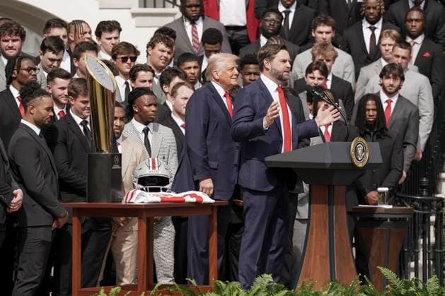 Vice President JD Vance flanked by President Donald Trump, speaks during a visit by the 2025 College Football National Champions - The Ohio State University on the South Lawn of the White House in Washington, DC on Monday, April 14, 2025.  WAS20250414566 KenxCedeno