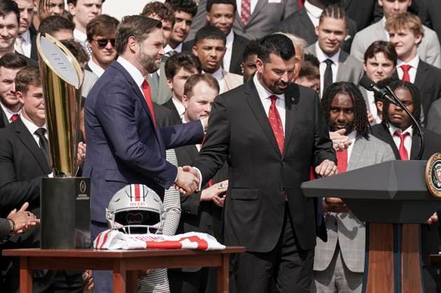 Vice President JD Vance shakes hands with Ryan Day, coach for the 2025 College Football National Champions - The Ohio State University on the South Lawn of the White House in Washington, DC on Monday, April 14, 2025.  WAS20250414567 KenxCedeno