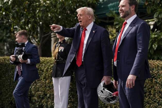 U.S. President Donald Trump points as Vice President JD Vance looks on after welcoming the 2025 College Football National Champions, Ohio State University on the South Lawn of the White House in Washington, DC on Monday, April 14, 2025.  WAS20250414601 KenxCedeno