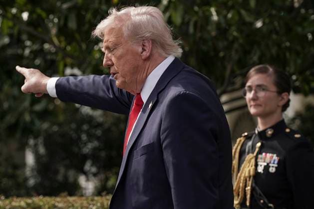 U.S. President Donald Trump points to the crowd after welcoming the 2025 College Football National Champions, Ohio State University on the South Lawn of the White House in Washington, DC on Monday, April 14, 2025.  WAS20250414603 KenxCedeno