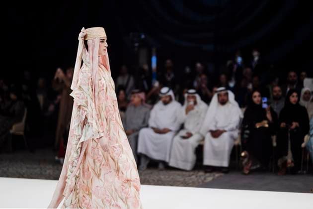 April 14, 2025, Abu Dhabi, United Arab Emirates: A model seen on stage for Miha. Designers Miha (Turkey), Salam Design (Palestine), Turana Atash (London - UK), Arta Kallaba (USA) and Khalifa Fund x Emirati Designers (UAE) attend the first runaway of Abu Dhabi Modest Fashion Week organized by Think Fashion at St. Regis Saadiyat Island Resort. Abu Dhabi United Arab Emirates - ZUMAs197 20250414_aab_s197_007 Copyright: xValeriaxFerrarox