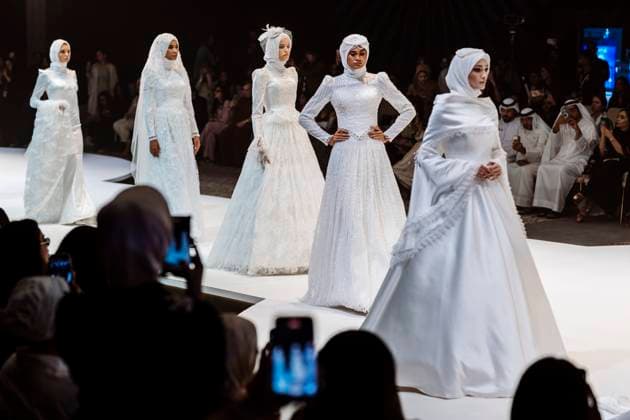 April 14, 2025, Abu Dhabi, United Arab Emirates: Models seen on stage for Salam Design. Designers Miha (Turkey), Salam Design (Palestine), Turana Atash (London - UK), Arta Kallaba (USA) and Khalifa Fund x Emirati Designers (UAE) attend the first runaway of Abu Dhabi Modest Fashion Week organized by Think Fashion at St. Regis Saadiyat Island Resort. Abu Dhabi United Arab Emirates - ZUMAs197 20250414_aab_s197_029 Copyright: xValeriaxFerrarox