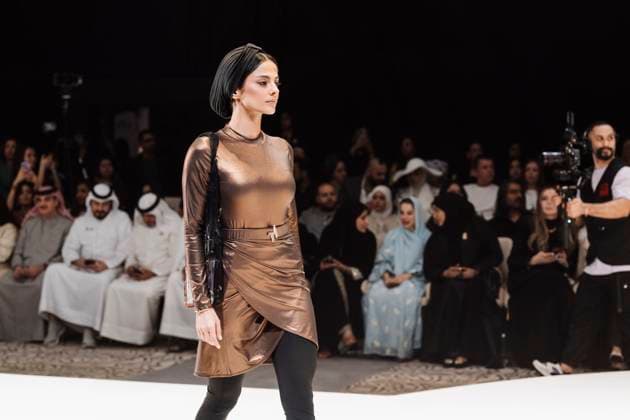 April 14, 2025, Abu Dhabi, United Arab Emirates: A model seen on stage for Turana Atash. Designers Miha (Turkey), Salam Design (Palestine), Turana Atash (London - UK), Arta Kallaba (USA) and Khalifa Fund x Emirati Designers (UAE) attend the first runaway of Abu Dhabi Modest Fashion Week organized by Think Fashion at St. Regis Saadiyat Island Resort. Abu Dhabi United Arab Emirates - ZUMAs197 20250414_aab_s197_034 Copyright: xValeriaxFerrarox