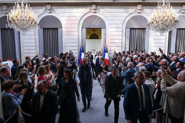Emmanuel Macron awards those involved in Notre Dame de Paris Cathedral restorations - FA Citizens involved in the restorations of Notre-Dame de Paris Cathedral arrive for their awarding ceremony at the Elysee Palace in Paris on April 15, 2025. Photo by Firas Abdullah ABACAPRESS.COM Paris Ile-de-France France  Copyright: xAbdullahxFiras ABACAx
