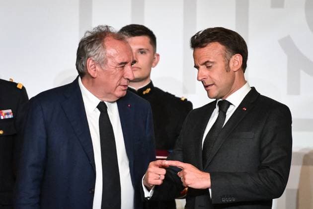 Emmanuel Macron awards those involved in Notre Dame de Paris Cathedral restorations - FA French President Emmanuel Macron speaks with French Prime Minister Francois Bayrou during awarding those involved in the restorations of Notre-Dame de Paris Cathedral at the Elysee Palace in Paris on April 15, 2025. Photo by Firas Abdullah ABACAPRESS.COM Paris Ile-de-France France  Copyright: xAbdullahxFiras ABACAx