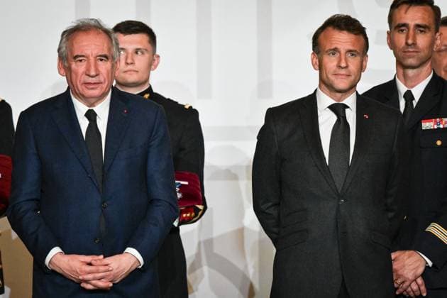 Emmanuel Macron awards those involved in Notre Dame de Paris Cathedral restorations - FA French President Emmanuel Macron looks on with French Prime Minister Francois Bayrou during awarding those involved in the restorations of Notre-Dame de Paris Cathedral at the Elysee Palace in Paris on April 15, 2025. Photo by Firas Abdullah ABACAPRESS.COM Paris Ile-de-France France  Copyright: xAbdullahxFiras ABACAx