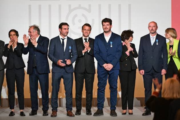 Emmanuel Macron awards those involved in Notre Dame de Paris Cathedral restorations - FA French President Emmanuel Macron poses for a photo after awarding those involved in the restorations of Notre-Dame de Paris Cathedral at the Elysee Palace in Paris on April 15, 2025. Photo by Firas Abdullah ABACAPRESS.COM Paris Ile-de-France France  Copyright: xAbdullahxFiras ABACAx