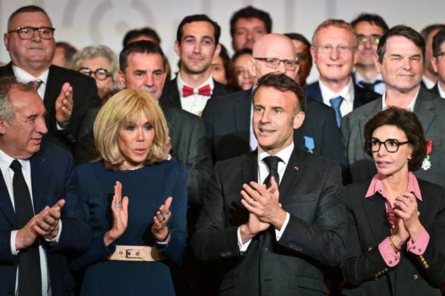 Emmanuel Macron awards those involved in Notre Dame de Paris Cathedral restorations - FA French President Emmanuel Macron poses for a photo with his wife Brigitte Macron after awarding those involved in the restorations of Notre-Dame de Paris Cathedral at the Elysee Palace in Paris on April 15, 2025. Photo by Firas Abdullah ABACAPRESS.COM Paris Ile-de-France France  Copyright: xAbdullahxFiras ABACAx