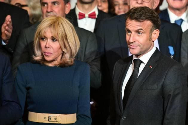 Emmanuel Macron awards those involved in Notre Dame de Paris Cathedral restorations - FA French President Emmanuel Macron poses for a photo with his wife Brigitte Macron after awarding those involved in the restorations of Notre-Dame de Paris Cathedral at the Elysee Palace in Paris on April 15, 2025. Photo by Firas Abdullah ABACAPRESS.COM Paris Ile-de-France France  Copyright: xAbdullahxFiras ABACAx