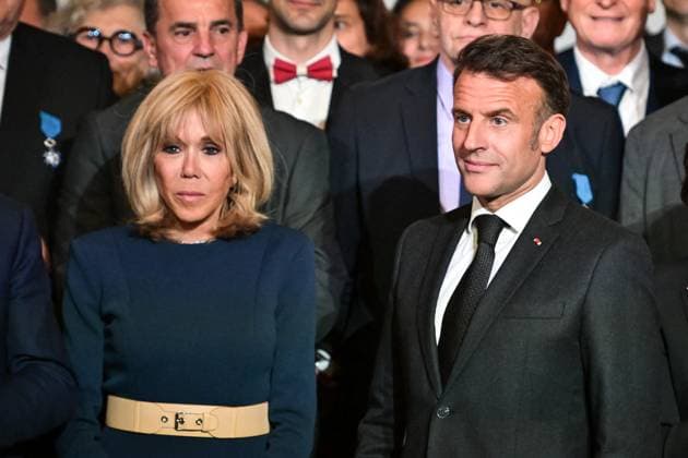 Emmanuel Macron awards those involved in Notre Dame de Paris Cathedral restorations - FA French President Emmanuel Macron poses for a photo with his wife Brigitte Macron after awarding those involved in the restorations of Notre-Dame de Paris Cathedral at the Elysee Palace in Paris on April 15, 2025. Photo by Firas Abdullah ABACAPRESS.COM Paris Ile-de-France France  Copyright: xAbdullahxFiras ABACAx