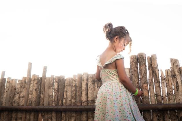 Creative Highlights Symbolfotos Young Girl in a Sunlit Backyard, Lost in Thought Santa Fe, New Mexico, United States R_PPFG240831-1523929-01 ,model released, Symbolfoto